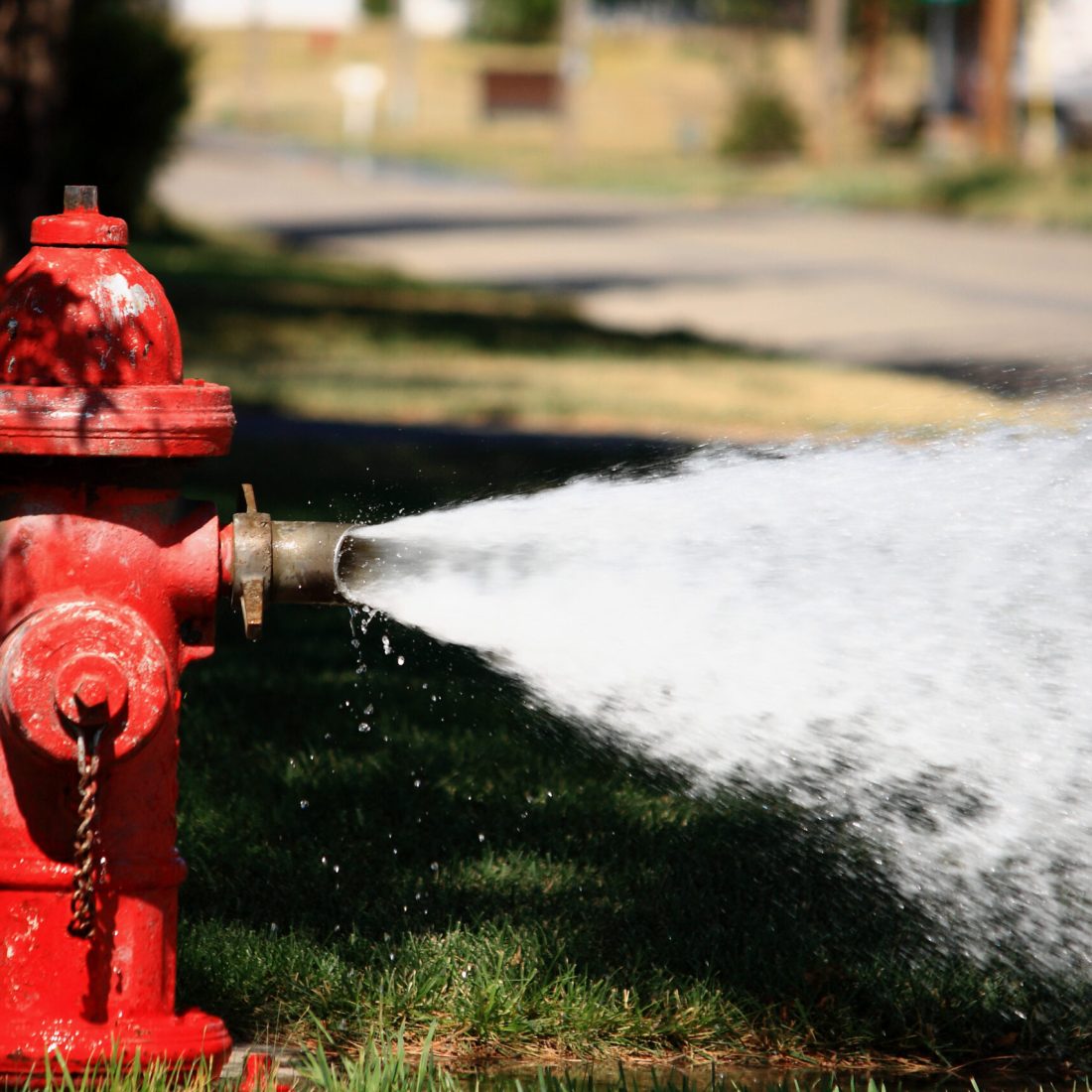 Open Fire Hydrant Spraying High Pressure Water